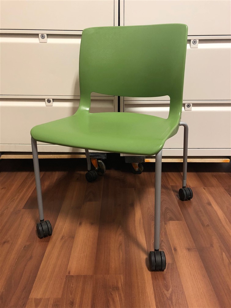 green chair on wheels